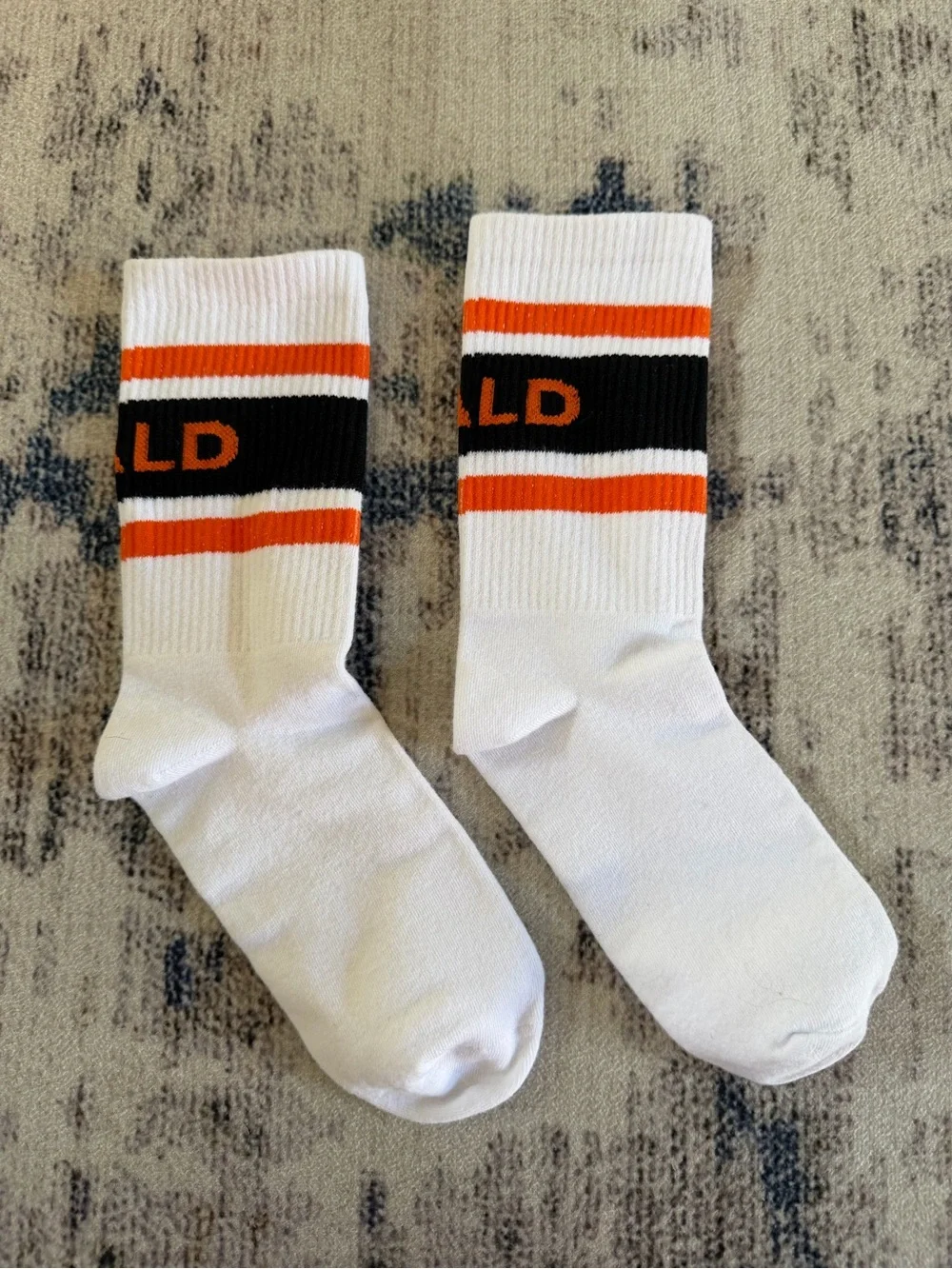 VALD White Crew Socks with Orange and Black Stripes